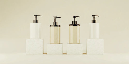 A modern, minimalist bathroom soap set with neutral-colored pump bottles.
