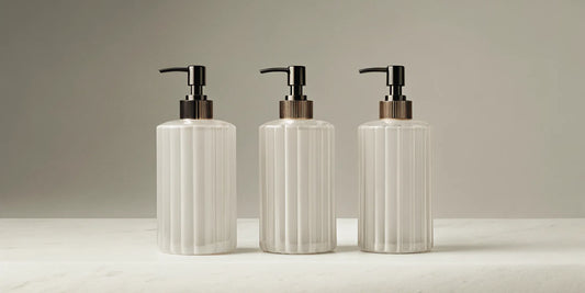 Three bottles of the best designer inspired hand soap on a marble counter.
