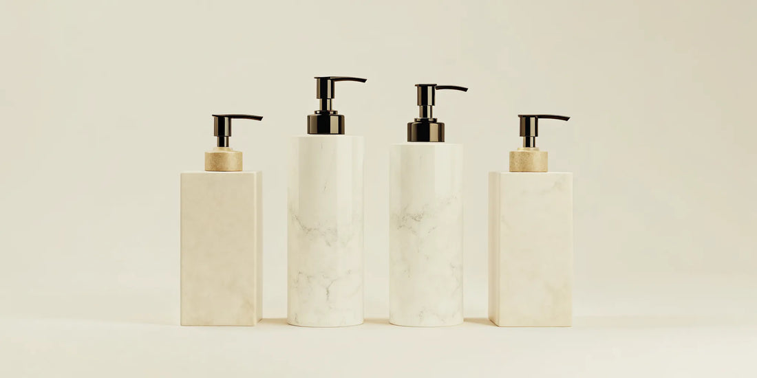 High-end soap dispensers with a marble finish and sleek pump design.