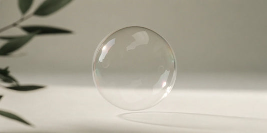 A moisturizing hand soap refill for dry skin creating a gentle bubble near soothing plant leaves.