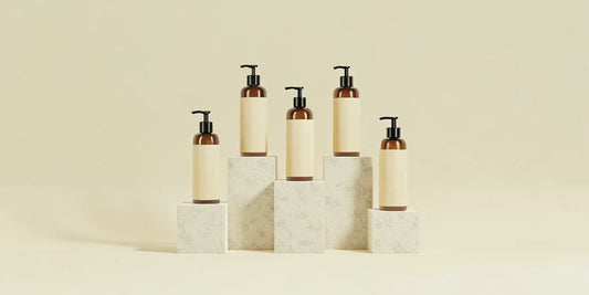 Minimalist hand wash bottles on stone blocks, similar to Aesop.