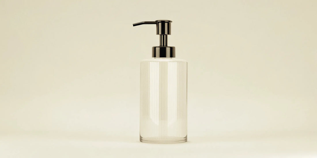 Clear glass soap dispenser pump for the kitchen.