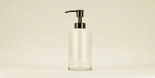 Clear glass soap dispenser pump for the kitchen.