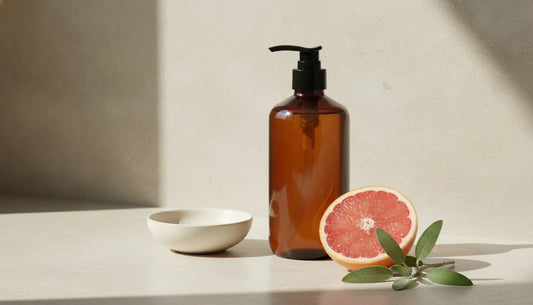 Sage grapefruit body wash setting with grapefruit and sage in a refined bathroom