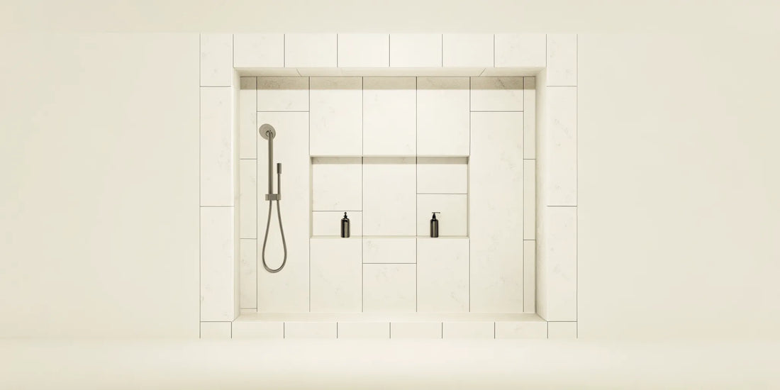 A pair of black soap dispensers for the shower in a tidy, minimalist bathroom.