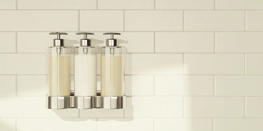 Wall-mounted three-chamber shower body wash dispenser.