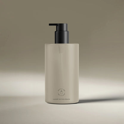 AEP Scent reusable, transluscent soap dispenser bottle in matte beige with black pump, minimalist design for premium refill use, photographed on a neutral background.